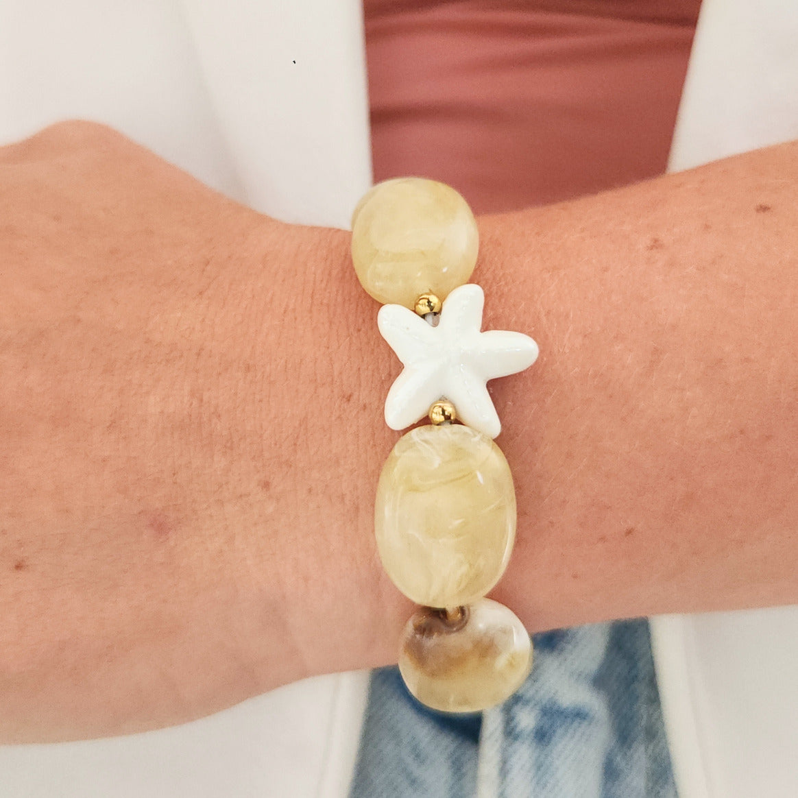 bracelet perles beiges étoile de mer