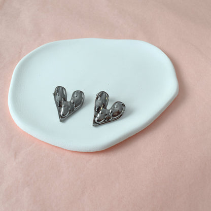Détail boucles cœur acier inoxydable